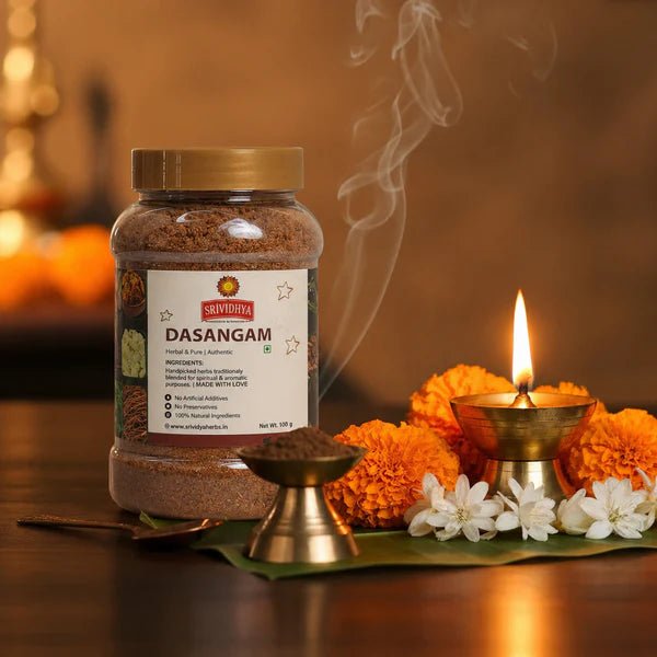 Aromatic smoke rising from a burning Dasangam powder incense cone on a brass plate during a Hindu home pooja ritual.